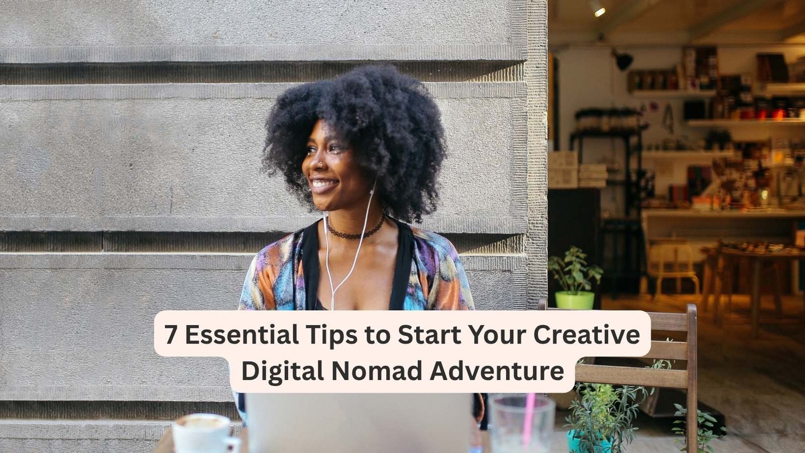 Creative digital nomad black woman sitting with her laptop and coffee/